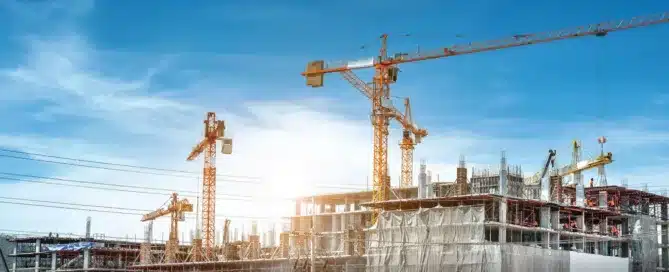 SMEs 8 Large cranes in operation at a construction site | image for the SMEs Industries page.